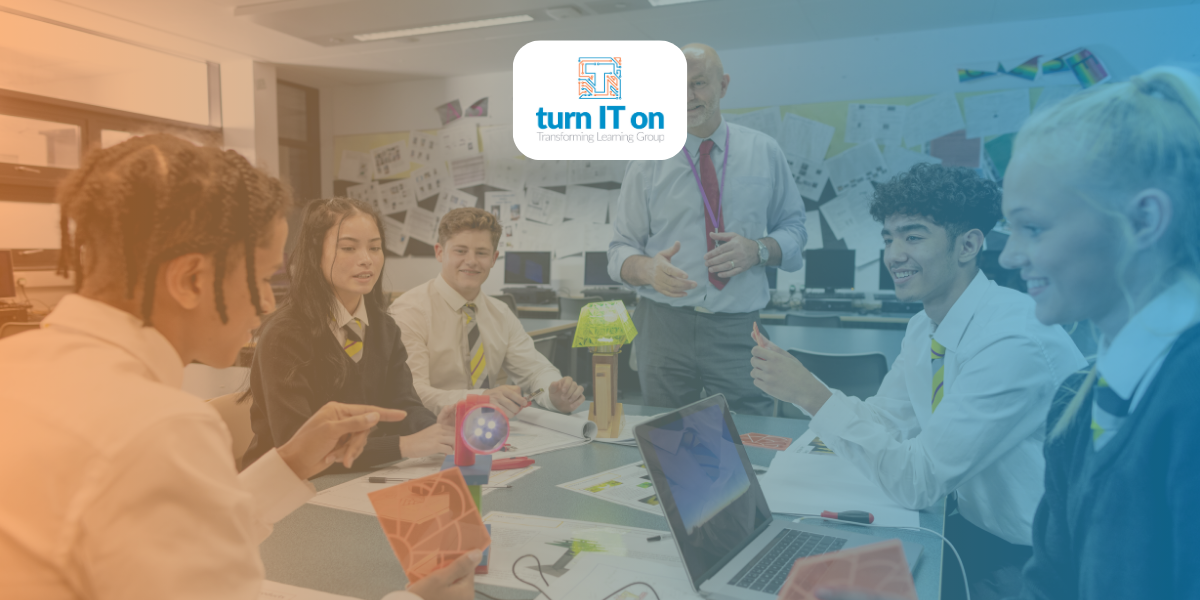 A teacher using technology with his class of students to support digital change in shcools